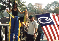 getting up on stilts and peace flag